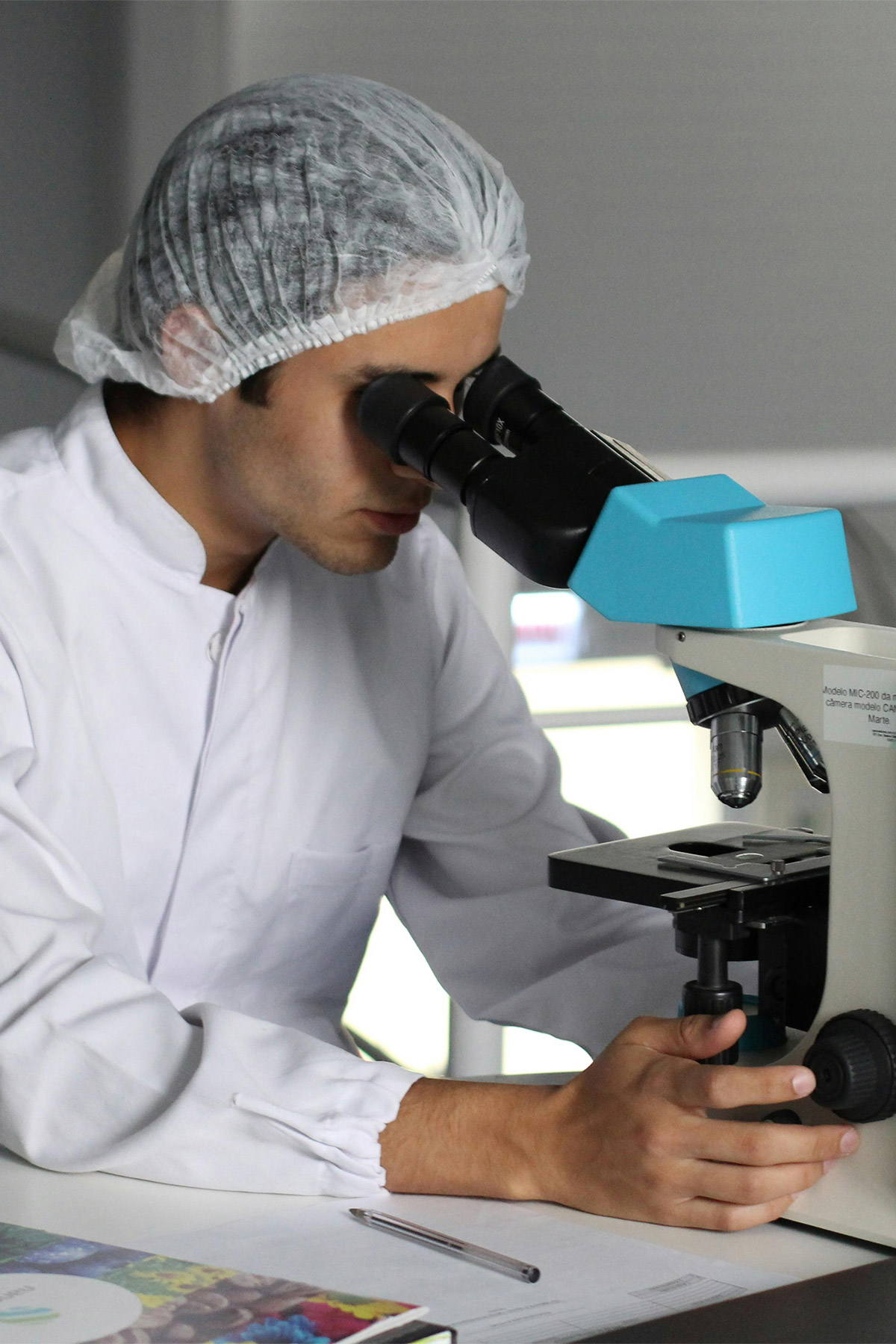 Scientist working in a laboratory with pipette and test tubes
